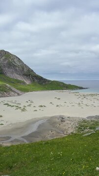 Breathtaking view of Bunes Beach from the Einangen pass overlooking the white sand and turquoise water, Lofoten Islands, Norway