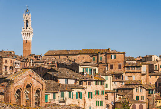 Siena view of medieval town, famous bell tower 'Torre del Mangia' on the Piazza del Campo di Siena, Tuscany, Italy