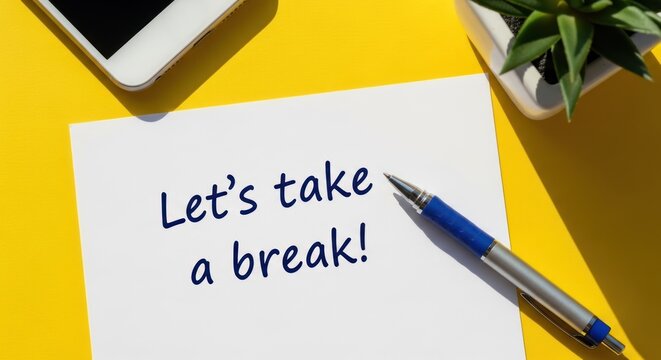 Lets Take a Break Message on Paper with Pen and Phone.
