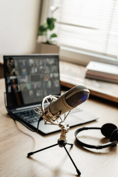 Home studio for podcast recording. Interior with microphone and laptop on table