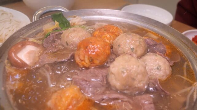Rolled dumpling hot pot with meat and vegetables