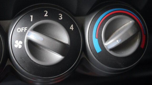 climate control, ac knob, heater dial, fan speed, temperature control, car interior, dashboard, instrument panel, rotary knob, toggle switch, off position, numbers, snowflake icon, cooling, heating, a