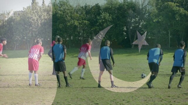 Soccer FK taker running up shooting ball keeper diving scoring crescent-star overlaying cheering