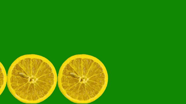 Fresh orange slices move across the frame in a rhythmic repeating pattern creating a vibrant visual display suitable for food advertising or health projects as the citrus fruit slices slide smoothly f