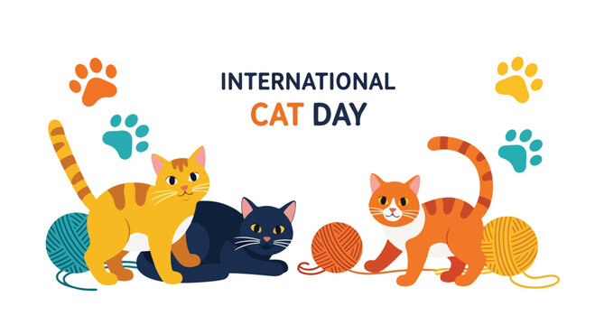 Three cats play with yarn on International Cat Day