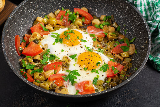 Gourmet Egg Breakfast with Tomatoes and Fresh Parsley