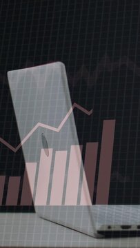 Vertical video: On startup laptop showing pie charts, data panels popping, bars rising for analysis
