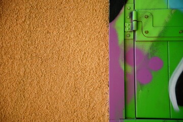 Old rural house window with colorful graffiti shutters on an ochre textured wall in Anafiotika, Plaka Athens, Greece. © ELENI MAVRANDONI