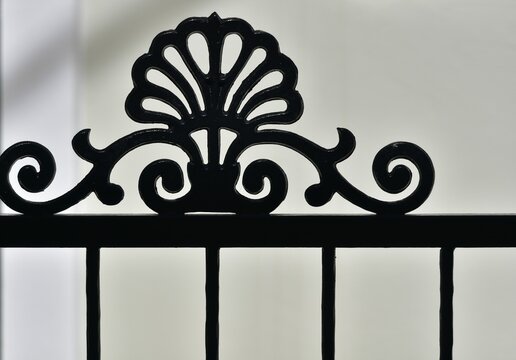 Old traditional rural house handcrafted wrought iron entrance gate railing in Andritsaina, Ilia Greece.