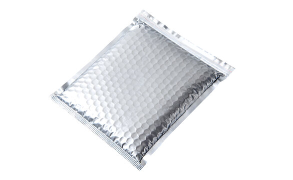 Silver metallic bubble mailer envelope isolated on white: Protective shipping and e-commerce packaging concept