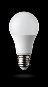 Bright white energy saving light bulb isolated against clear background