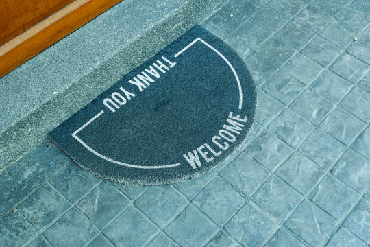 Black carpat in coffee shop,modern door mat entryway outdoor mat Welcome mats entry grey mat on floor,selective focus..