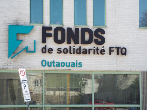 Gatineau, Quebec, Canada &ndash; April 18, 2026: The "Fonds de solidarit&eacute; FTQ Outaouais" sign is mounted on a light brick building above a large window at  259 Boulevard Saint-Joseph Bureau 207.