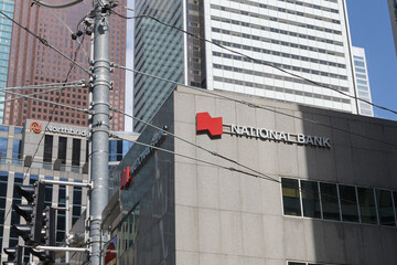 Fototapeta premium view of National Bank sign outside 121 King St W, Floor 1 of Roserock Place, Toronto