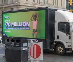 Fototapeta premium mobile digital billboard truck displaying advertisements on Front St W (LottoMAX, Interprovincial Lottery Corporation), Toronto