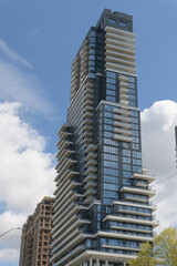 Fototapeta premium south elevation of Chateau Auberge on the Park, a luxury 39-storey condominium by Tridel located at 10 Inn on the Park Dr, Toronto