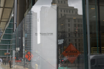 Fototapeta premium glass display window and sign of Four Seasons Centre for the Performing Arts located at 145 Queen St W, Toronto