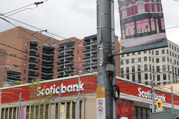 Fototapeta premium exterior building facade and sign of Scotiabank, a bank branch, located at 222 Queen St W, Toronto