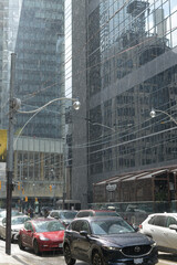 Fototapeta premium rain shower during rush hour traffic on Adelaide St W east of University Av, Financial District, Toronto