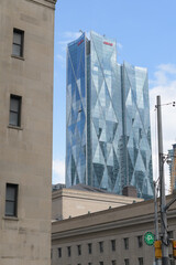 Fototapeta premium contrast of historic buildings and CIBC Square, designed by WilkinsonEyre + Adamson Associates, headquarters of Canadian Imperial Bank of Commerce, looking southeast from Front St W, Toronto