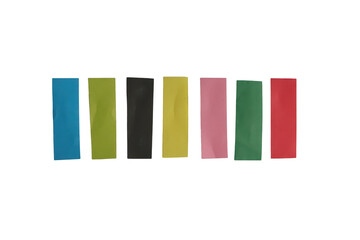 Fototapeta premium A vibrant assortment of seven rectangular strips of colored paper arranged in a neat horizontal row against background.