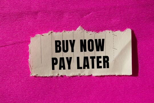 Buy now pay later message written on ripped torn paper background. Conceptual Buy now pay later symbol. Copy space.