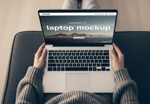 Top view of a laptop on a persons lap &ndash; mockup