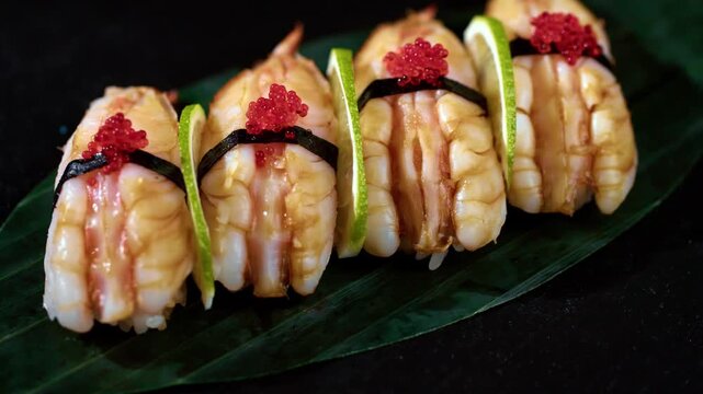 Close-up footage of sushi preparation by a chef. Fresh ingredients, precise knife skills, rolling sushi, and detailed textures create a clean and professional culinary scene. Ideal for food, restauran