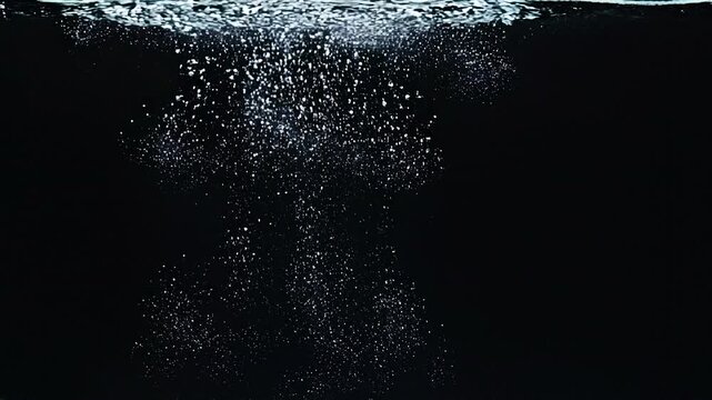 Air Bubbles Rising in Water on Black Background Slow Motion Video for Advertising and Video Backdrop