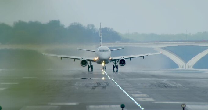 Rainy Morning with Jet Taking Off from Runway at Reagan National Airport