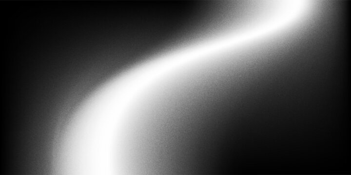Sandblasted or brushed titanium or steel metal surface, the light reflection of the curved lines creates a smooth gradation on the dark black metallic background