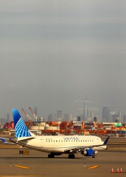 United Express jet taxiing at Newark Airport EWR with Manhattan skyline in the background