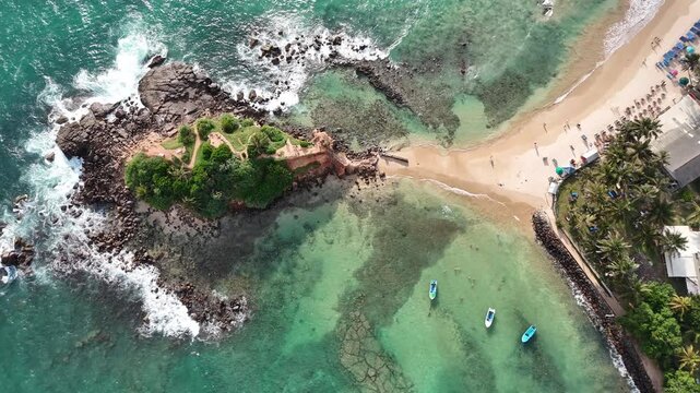 Aerial View Above Parrot Rock Beach In Mirissa Sri Lanka
Aerial drone footage above Parrot Rock beach and turquoise ocean in Mirissa Sri Lanka May 2026.
