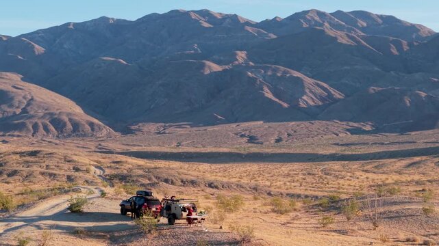 Catch aerial views of a teardrop camper and SUV camping in Anza Borego Desert State Park on Thimble Trail in Californias wilderness.