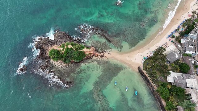Aerial View Above Parrot Rock And Mirissa Beach Sri Lanka
Aerial drone footage above Parrot Rock island and tropical Mirissa beach Sri Lanka May 2026.
