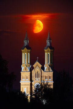 Moonset over catholic church towers