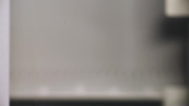 Flatbed scanner close up showing delicate sensor strip and mechanical components under soft light