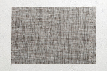 Fototapeta premium Top view of grey tablecloth for food on cement background. Empty space for your design