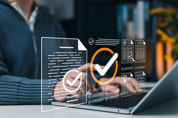 Fototapeta na wymiar Document verification approval and compliance checklist concept. Person using laptop with verified files, check marks, certificate, review forms, quality control, audit process, business assurance