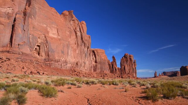 The dramatic red sandstone formations of Monument Valley, located within the Navajo Tribal Park on the border of Utah and Arizona