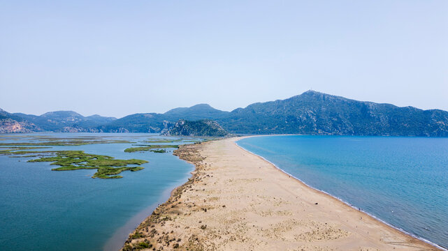 Iztuzu Beach, Turkey - May 9, 2026: Aerial drone view of Iztuzu Beach near Dalyan, Muğla Province, Turkey, showing the sandy coastline, turquoise Mediterranean Sea, Dalyan river