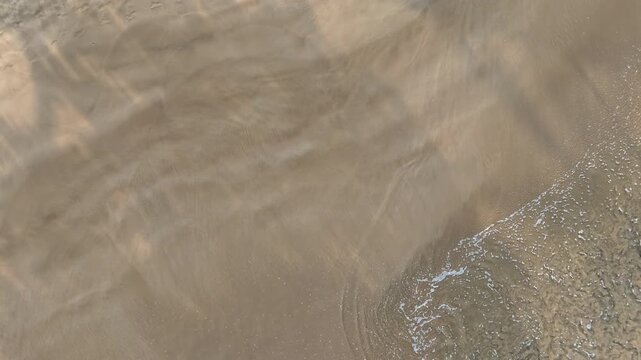 Aerial Ocean Wave Retreating From Sandy Beach Sri Lanka
Aerial drone footage showing ocean wave retreating dramatically from sandy beach Sri Lanka May 2026.
