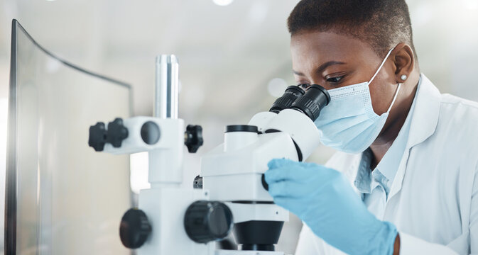 Black woman, mask and microscope for scientist with sample for medical research or pharmacy in lab. Biotech, science experiment and analysis for pathology, drug and synthesis for solution development