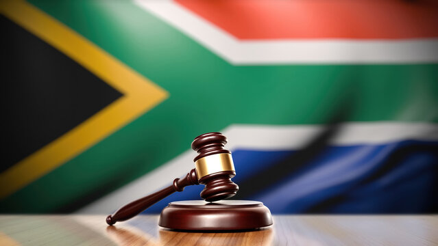 Judge gavel before blurred South African national flag