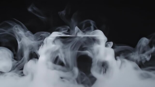 Black cauldron with white smoke rising on a dark background