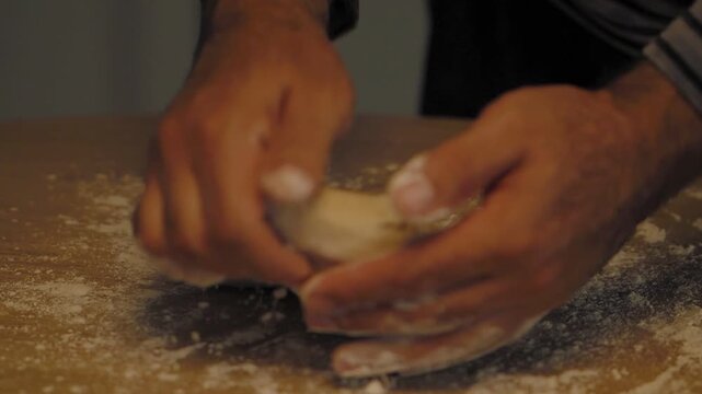Preparing and rolling dough on floured table