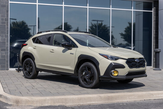 Subaru Crosstrek Sport Hybrid Compact SUV display. Subaru offers the Crosstrek with a 2.5L DOHC BOXER Hybrid engine. MY:2026