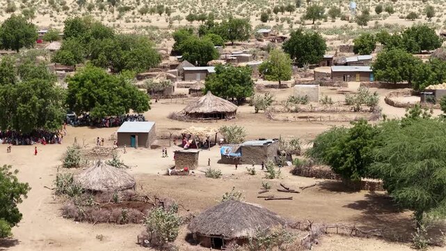 Drone view of traditional village huts and community gathering, April 25, 2026, Chad, N Djamena
