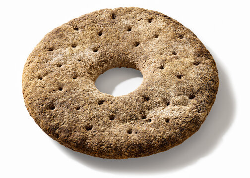 Finnish ring shaped rye bread on white background