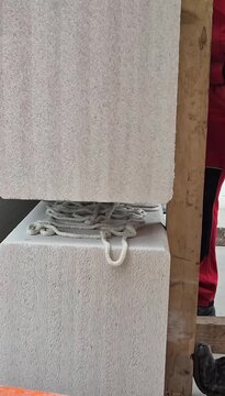 Crane lowering prefab wall bottom view - Vertical 9:16